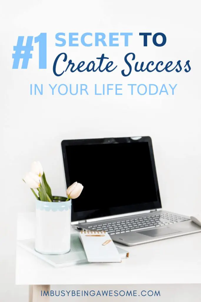 Laptop on desk with flowers and notepad. Text: #1 Secret to Create Success in Your Life Today.