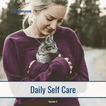 Woman holding a kitten, representing daily self-care.