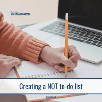 Creating a not to-do list. Hand writing in notebook with laptop in background.