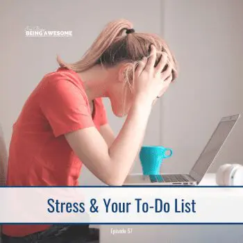 Stressed woman with head in hands at laptop, thinking about her never ending to-do list.