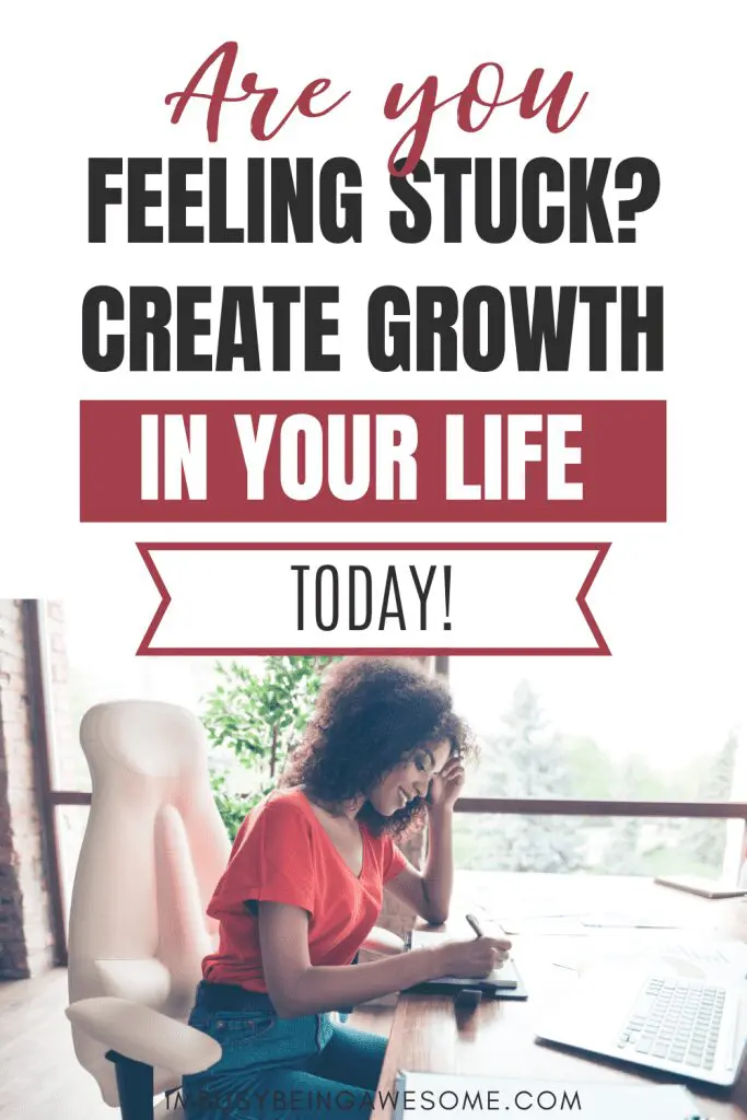 Woman writing at desk, creating growth. "Are you feeling stuck? Create growth in your life today!