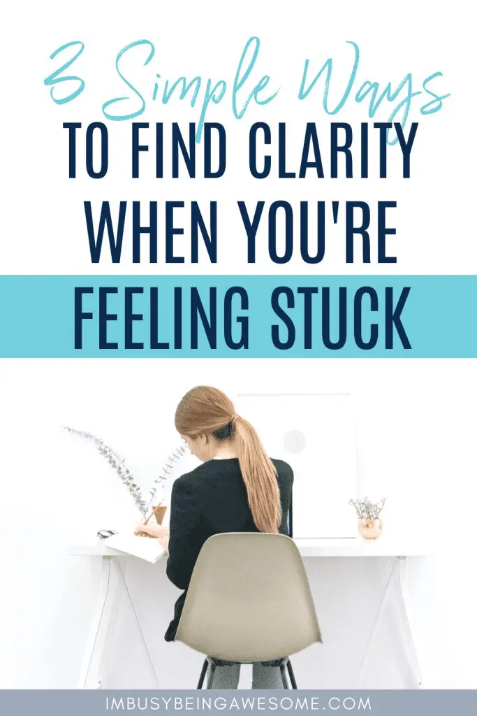 Woman writing at desk, "3 Simple Ways To Find Clarity When You're Feeling Stuck