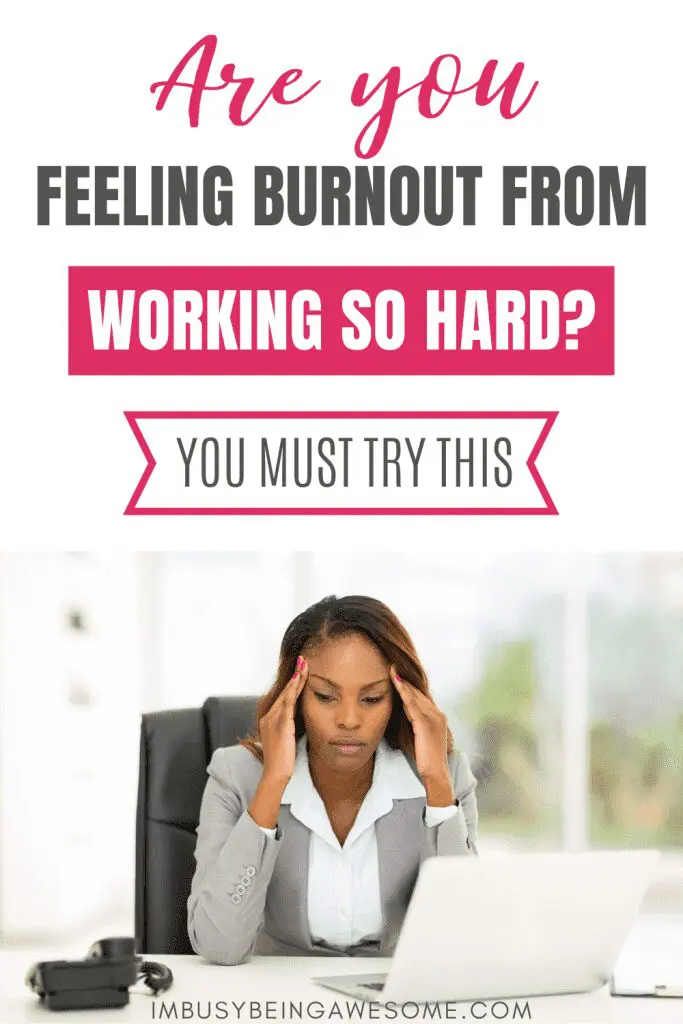 Burned out woman at desk with laptop, feeling stressed.