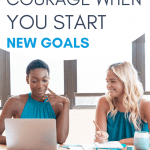 Two women collaborating on new goals, working at a desk.