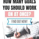 Person writing in notebook with "How many goals should you work on at once?" text overlay.