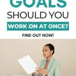 Woman at desk with laptop and coffee, pondering "How Many Goals?