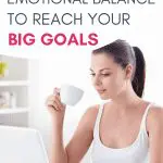 Woman with laptop and coffee, focusing on emotional balance to reach goals.