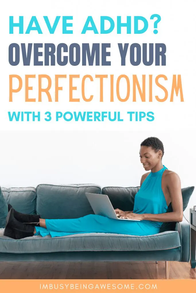 Woman on couch with laptop, overcoming perfectionism with ADHD.