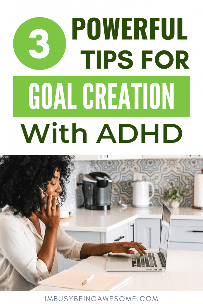 Goal creation with ADHD: Woman working on laptop while on phone in kitchen.