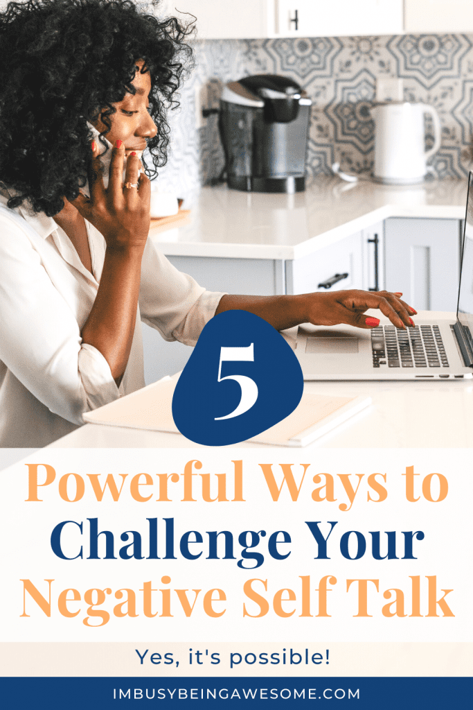 Woman on phone working on laptop. Text: 5 Powerful Ways to Challenge Your Negative Self Talk.