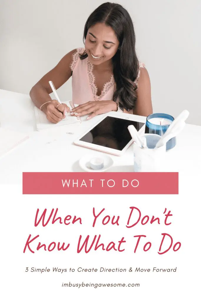 Woman writing in notebook at desk with tablet and candle, "When You Don't Know What To Do.