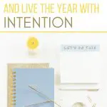 Notebook, pen, and candle with the text "How to choose a word of the year.