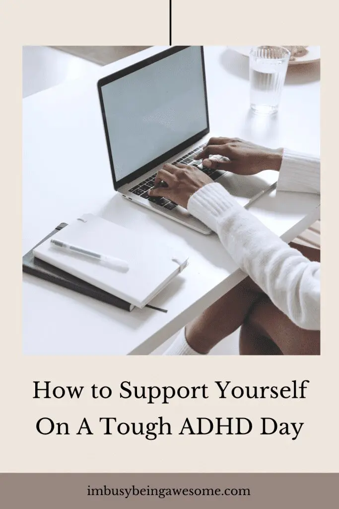Person typing on a laptop with notebooks and a glass of water. "How to Support Yourself On A Tough ADHD Day.