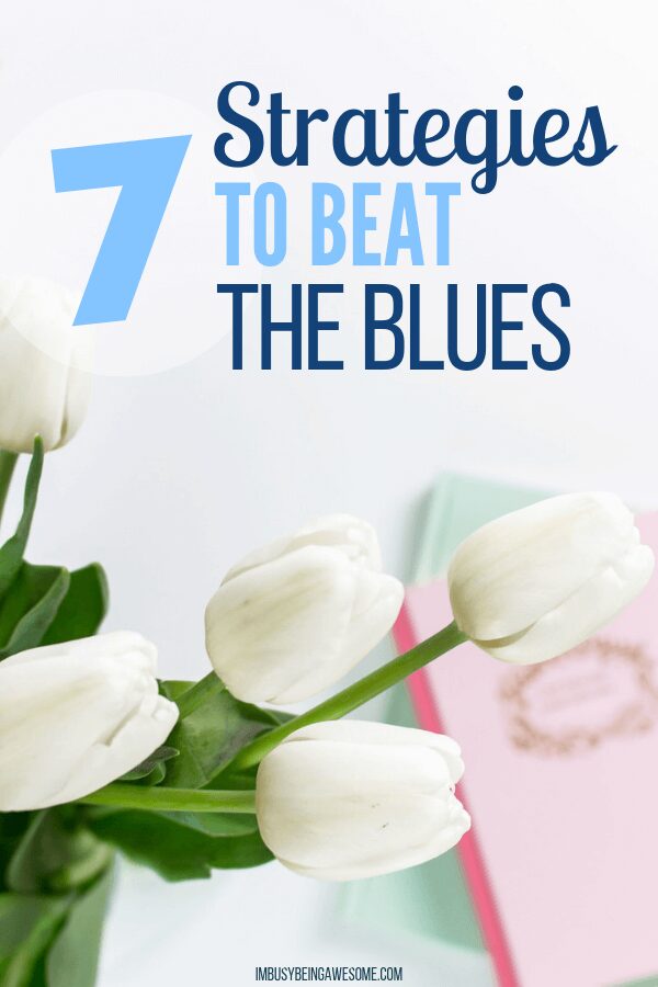 Strategies to beat the blues, featuring white tulips and a book.
