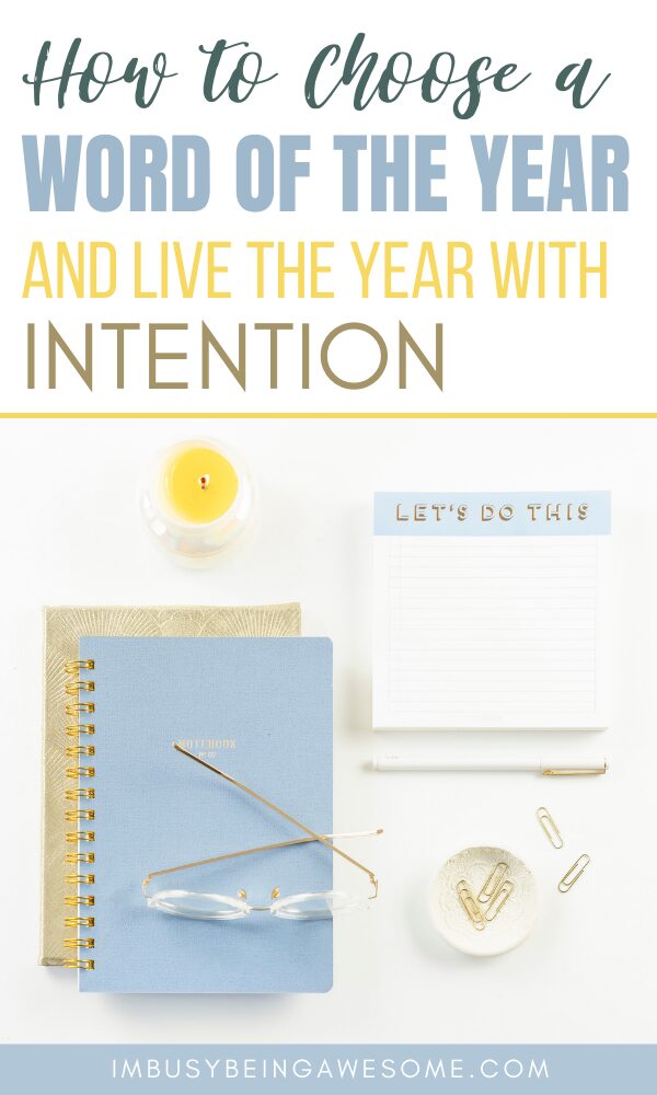 Notebook, pen, and candle with the text "How to choose a word of the year.