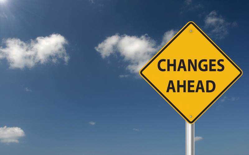 Yellow road sign reading "CHANGES AHEAD" against a blue sky. How to make a change with ADHD.