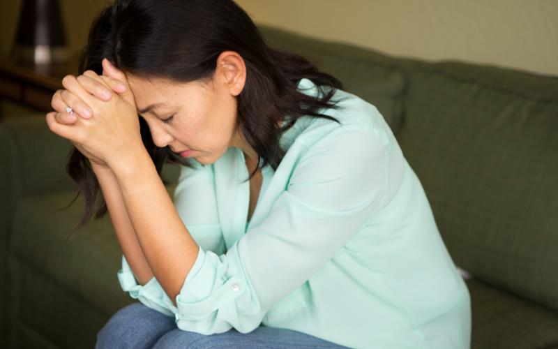woman looking worried and stressed