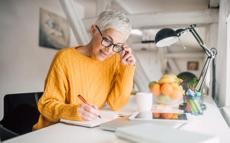 woman writing in notebook