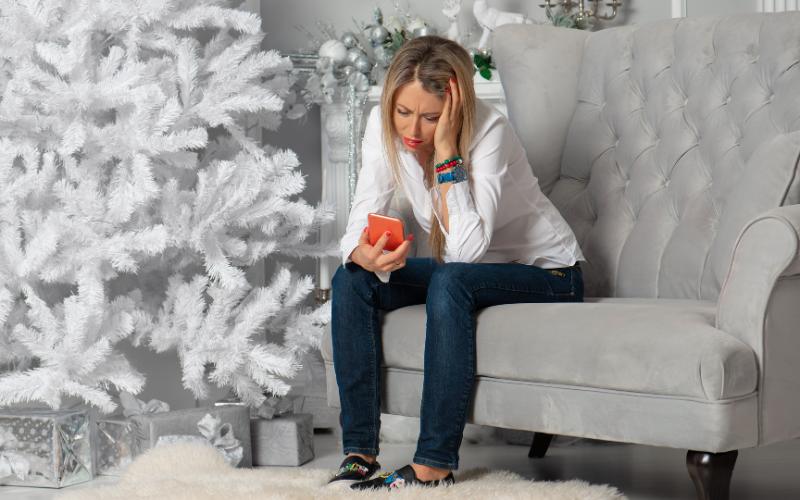 woman looking stressed at Christmas time