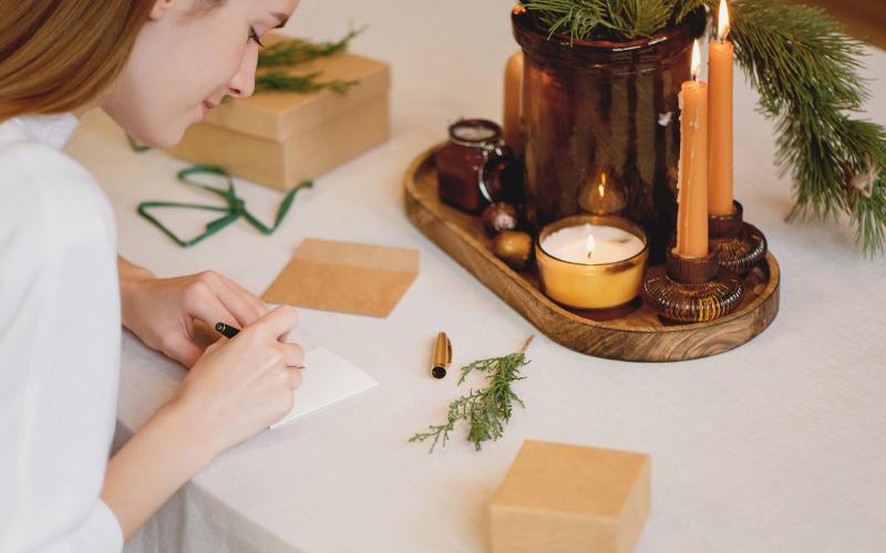 woman writing christmas cards