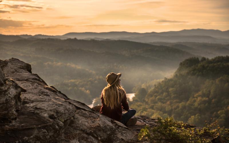 woman looking at view of mountains