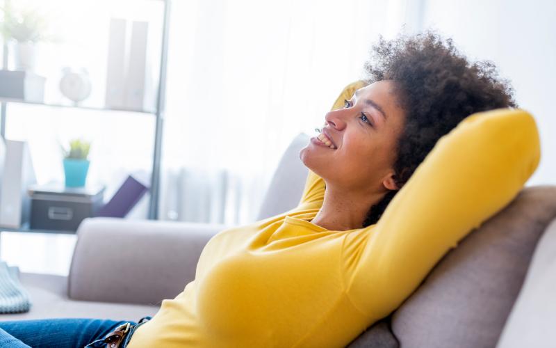 woman relaxing on a sofa