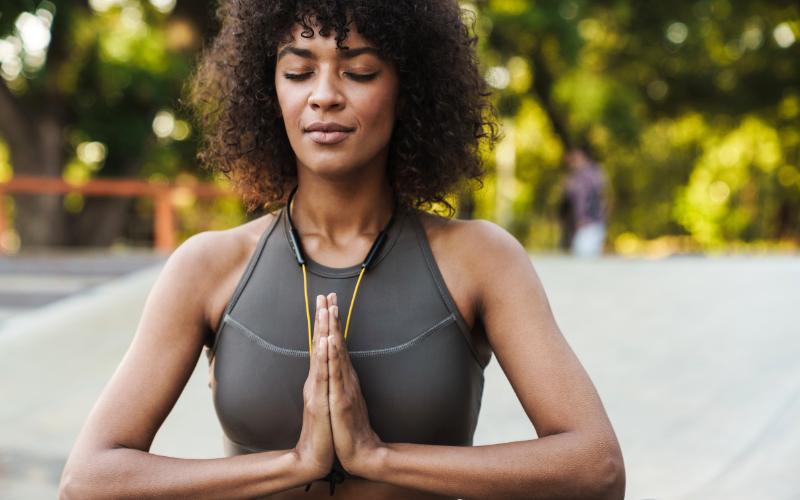 woman meditating outside