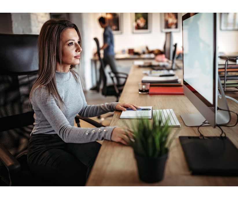 Woman working at computer, demonstrating ADHD executive function skills